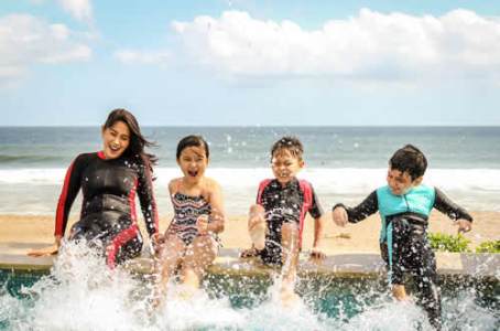 a group of people in a body of water