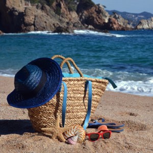 a person sitting on top of a sandy beach