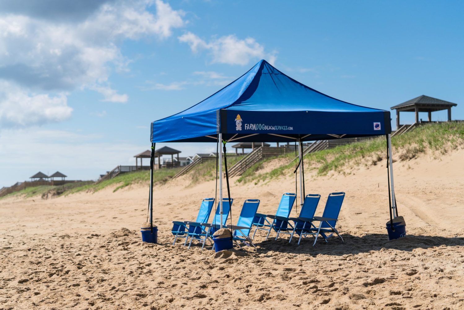 an umbrella sitting on top of a sandy beach