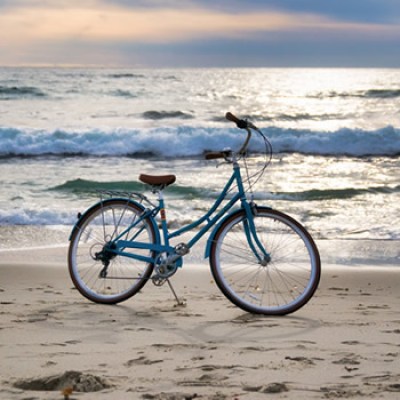 a bicycle is parked next to a body of water