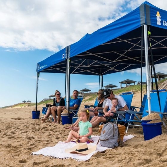 a person sitting on top of a sandy beach