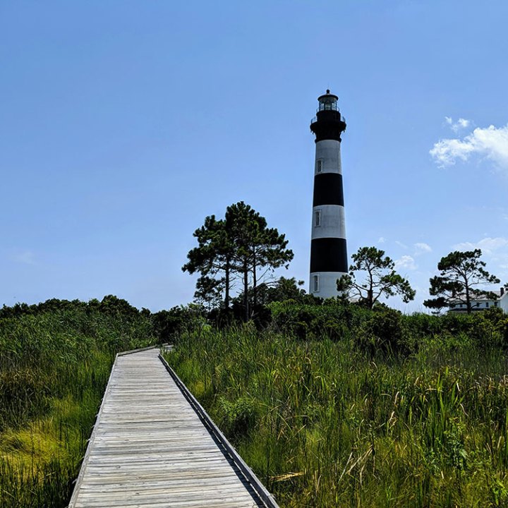 a lighthouse in a country setting