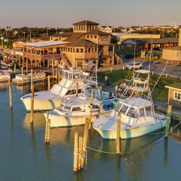 a boat is docked next to a body of water