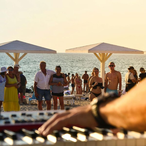 a group of people on a beach